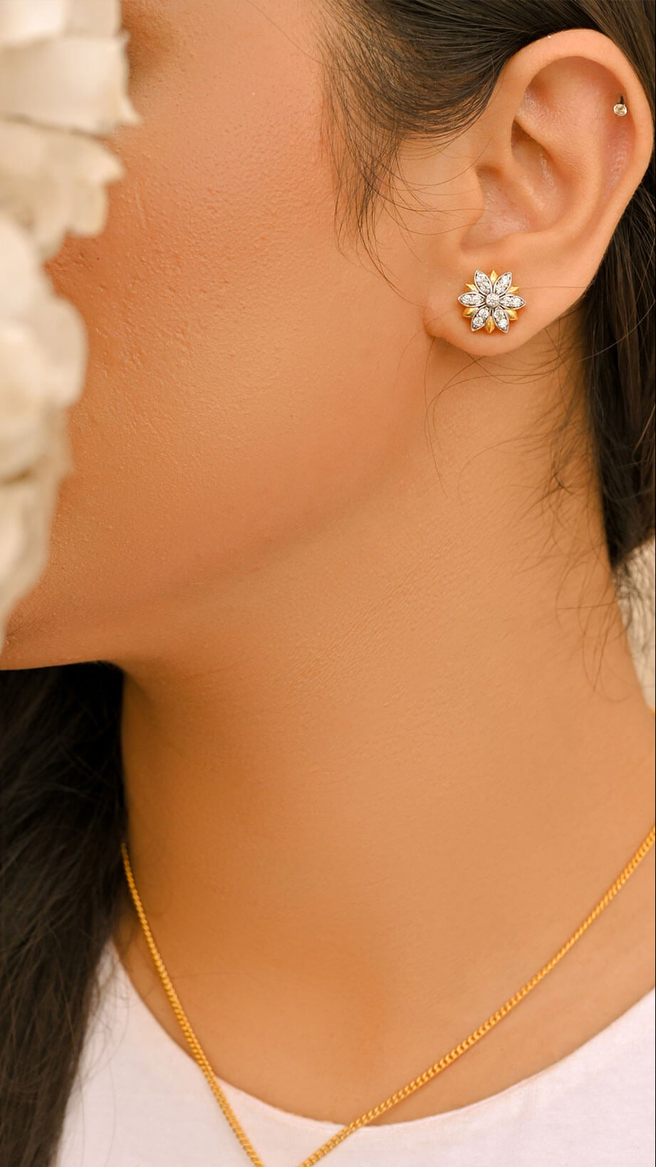 Lotus Earrings worn on the ear — golden-polish lotus flower top in 925 sterling silver, shown with the matching Lotus pendant — Nuqrah Pakistan